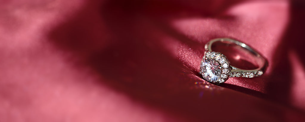 diamond ring on red fabric
